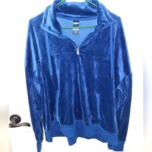 A Champion blue velour 1/4 zip pullover in a ladies size XL with thumb holes.